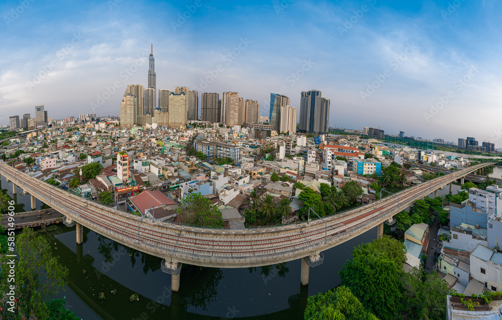 Obraz premium Beautiful aerial view at night in Ho Chi Minh City, see the Landmark 81 tower, the tallest tower in Vietnam. Subway track tracks below. Travel concept