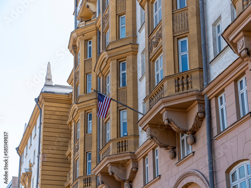 Obraz na plátne Wrapped around flagpole flag of the USA in Russia Moscow