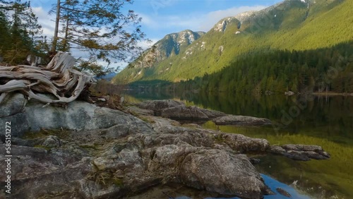 Peaceful Nature Scene by the lake, Canadian Mountain Landscape Background. Buntzen Lake in Vancouver, British Columbia, Canada. Slow Motion photo