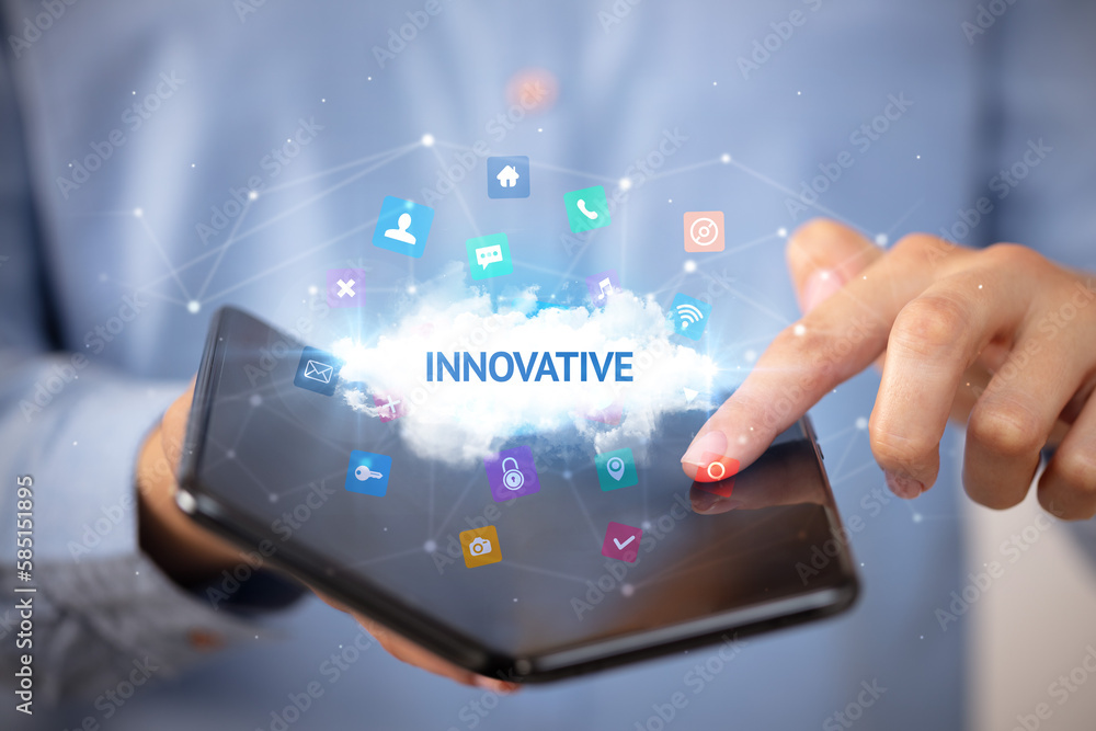 Businessman holding a foldable smartphone, technology concept Businessman holding a foldable smartphone, technology concept