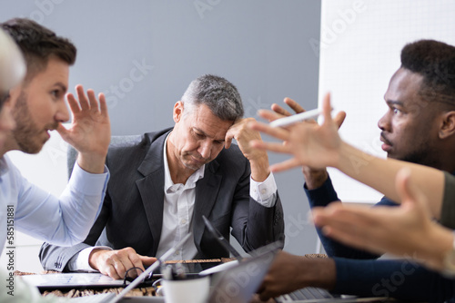 Business People Arguing In Meeting photo
