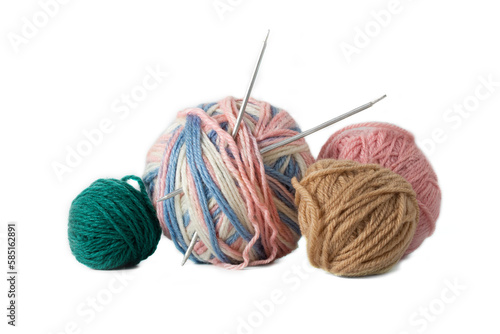 a tangle of multicolored threads and knitting needles