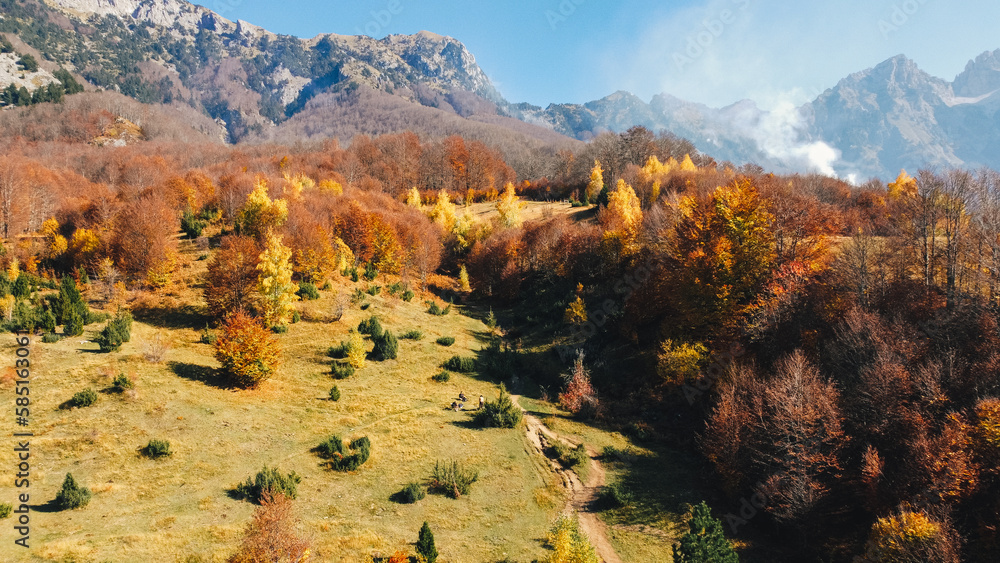 Ariel drone shot of Theth - Valbona hiking trail in autumn, Albania.