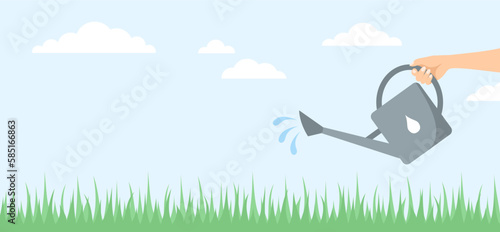 A hand watering the grass from a watering can on a blue background with clouds. Spring banner with copy space. Flat vector illustration