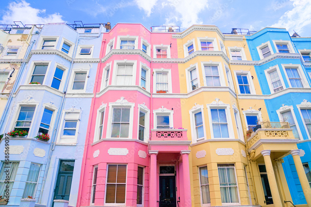 Colorful pastel houses of Notting Hill, London, England. Upward street view.