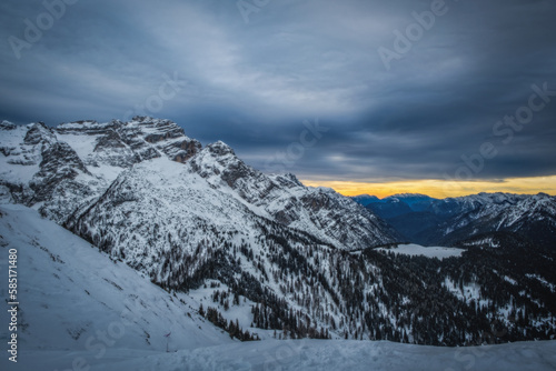 Sunrise in a winter day with fresh snow. Italy, Trentino Alto Adige, Pinzolo and Madonna di Campiglio. January 2023