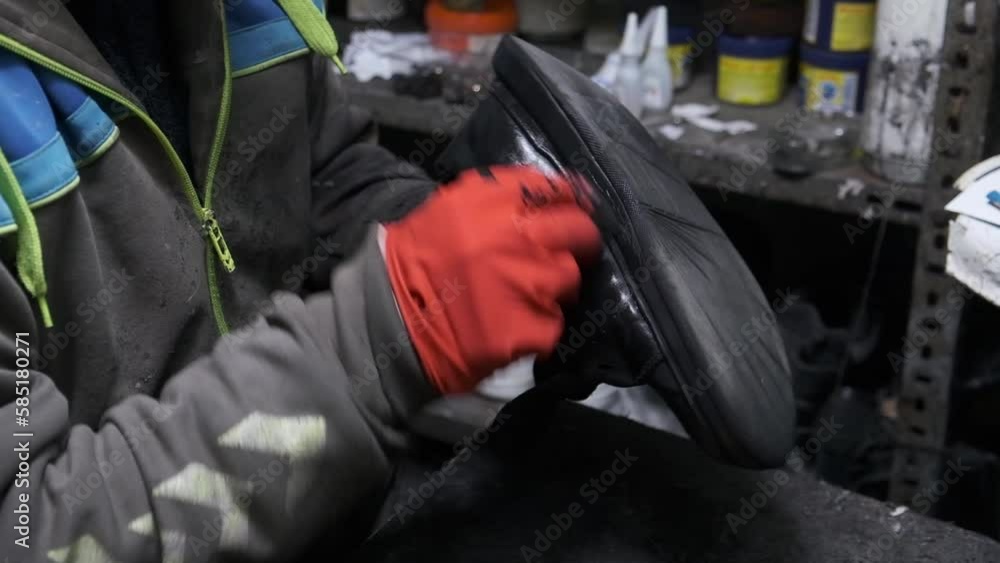 a shoe repairman who shines shoes a shoe repairman who shines shoes