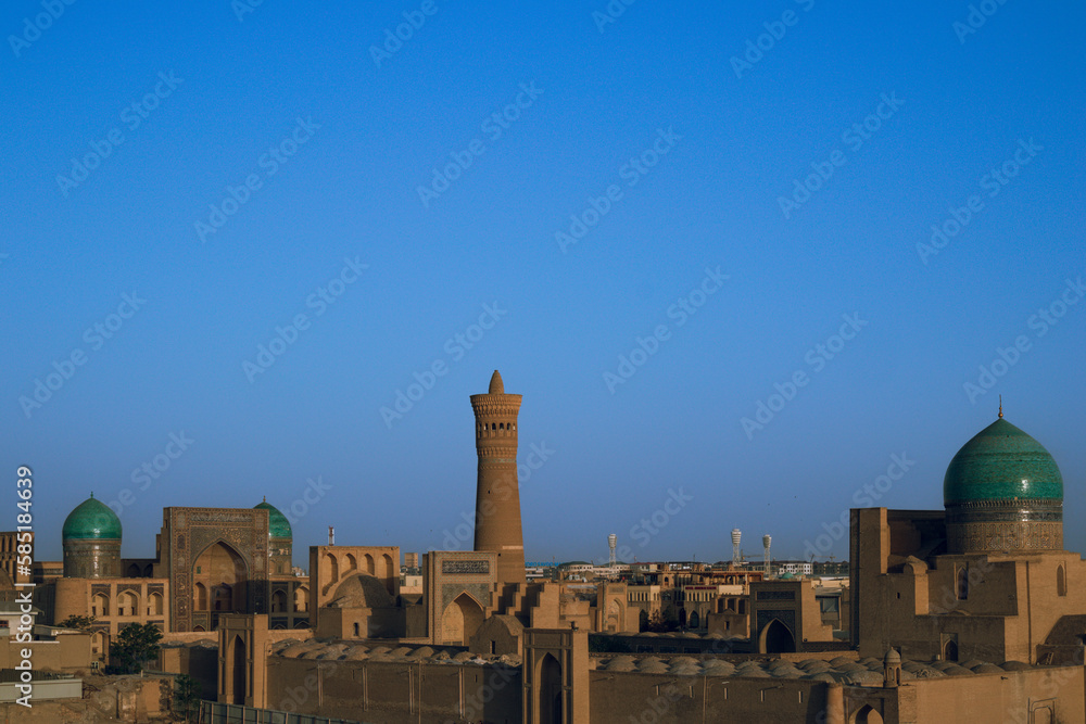 Sunset and Persian architecture in the ancient silk road city of Bukhara, Uzbekistan     