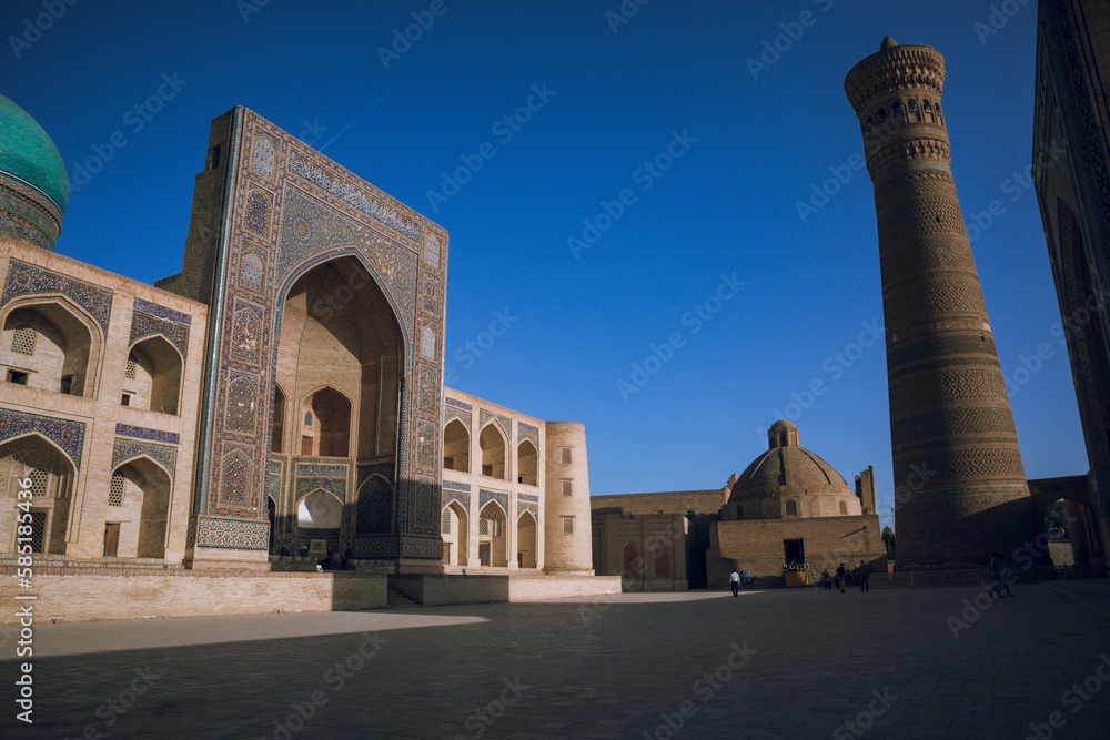 Sunset and Persian architecture in the ancient silk road city of Bukhara, Uzbekistan, Po-i-Kalan Islamic religious complex