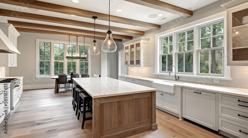 Traditional kitchen in beautiful new luxury home with hardwood floors, wood beams, and large island quartz counters. Includes farmhouse sink, elegant pendant lights, and large windows.