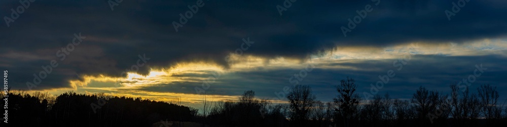 Forest, dark clouds at sunset. Forest, dark clouds at sunset.