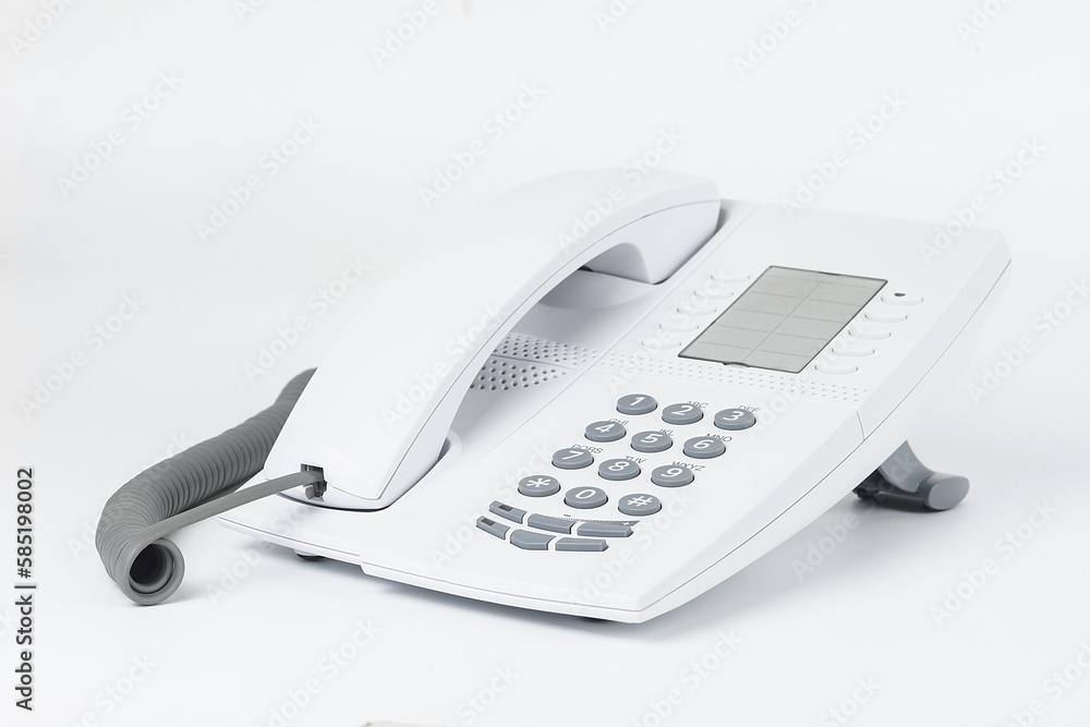 White office desk phone isolated on white. White office desk phone isolated on white.