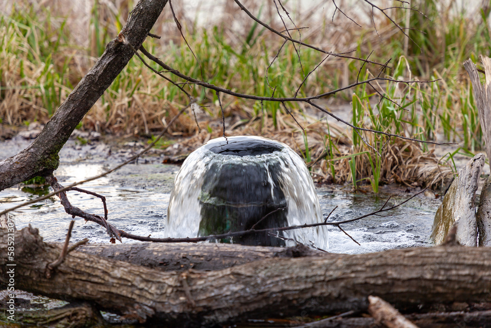 Drainage pipe connecting reservoirs during spring floods. Drainage pipe connecting reservoirs during spring floods.