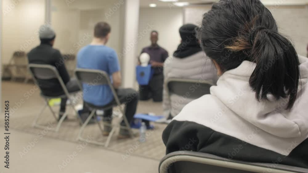CPR training class by security guard in office CPR training class by security guard in office
