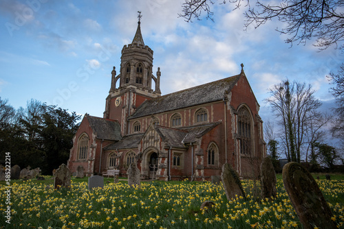 old Anglican church in the village with flowers