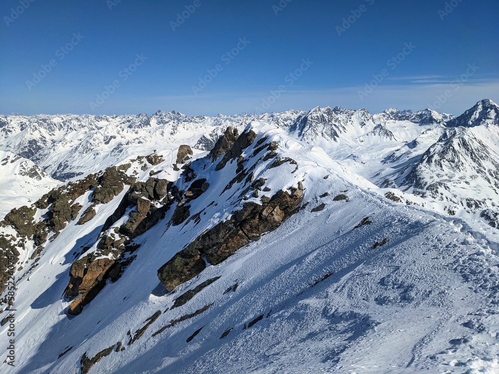View from the summit of the Flüela Wisshorn above Davos and the Flüela Pass. Ski mountaineering in the Swiss mountains. Wonderful mountain panorama. Davos Klosters Mountains. High quality photo