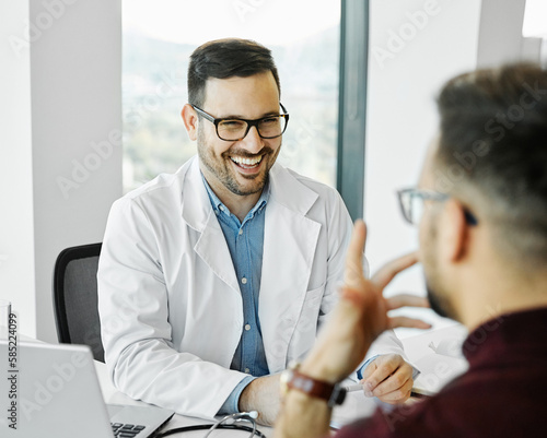 doctor patient hospital care medical medicine man health clinic portrait discussion office professional indoor explaining visit expertise physician listening talking occupation practitioner