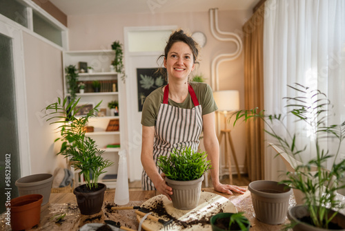 woman gardener florist portrait at home indoor happy female smile