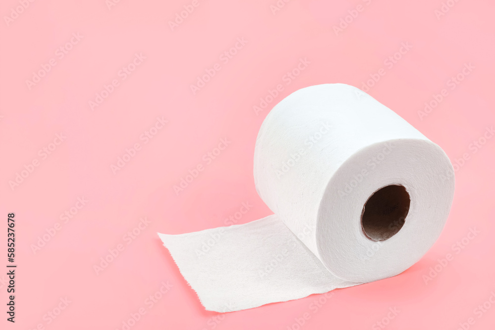 Toilet paper roll isolated on pastel pink background. Fresh colour with soft paper texture. Everyday object, design element, close up and copy space. Toilet paper roll isolated on pastel pink background. Fresh colour with soft paper texture. Everyday object, design element, close up and copy space.