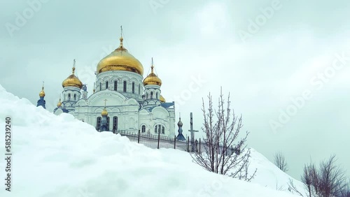 Belogorsky St. Nicholas Orthodox Missionary Monastery. Russia, Perm Krai, Belaya Gora. The temple on the hill in winter. Monastery on the background of snow. 4K photo