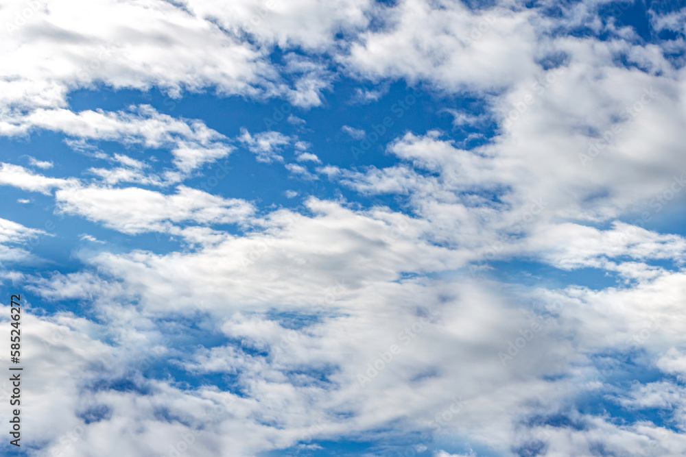 Beautiful blue sky with large white clouds backdrop. April weather spring sky background Beautiful blue sky with large white clouds backdrop. April weather spring sky background