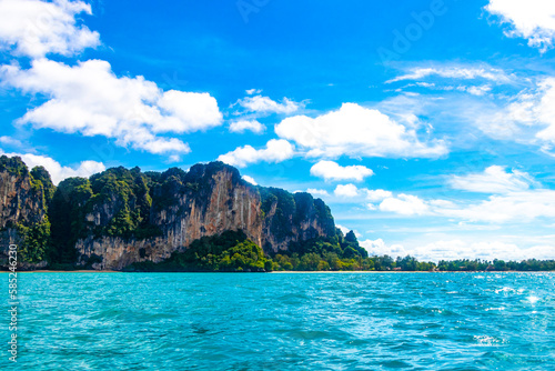 Tropical paradise turquoise water beach and limestone rocks Krabi Thailand. © arkadijschell