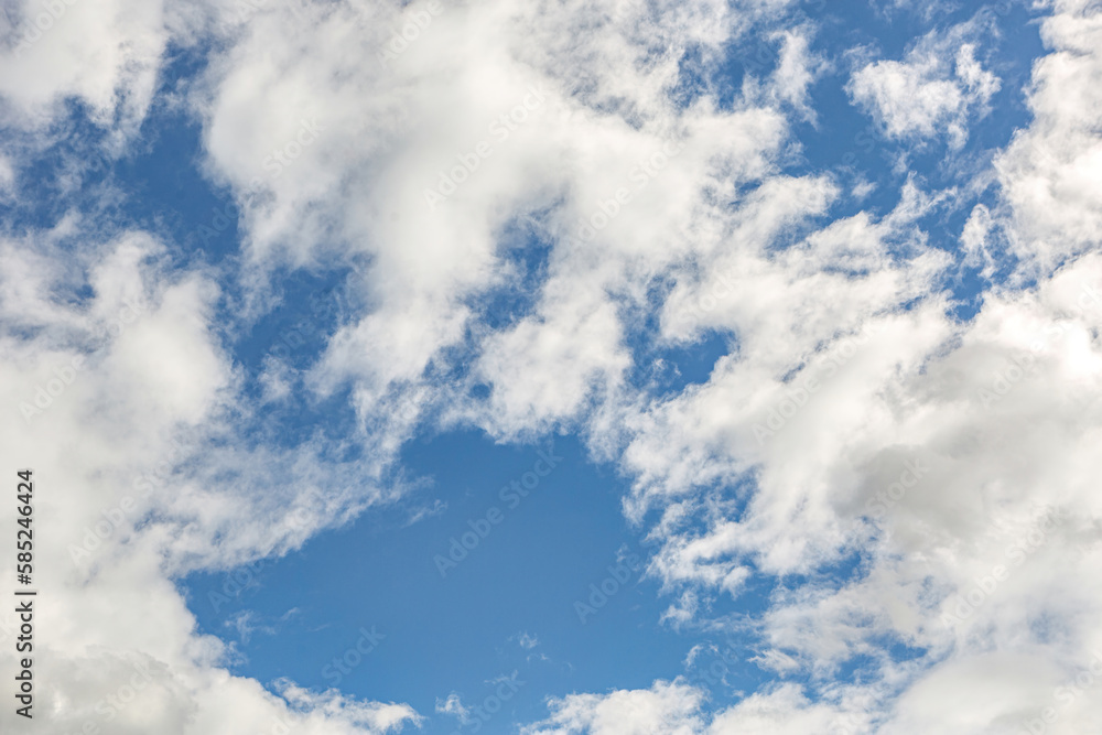 Beautiful blue sky with large white clouds backdrop. April weather spring sky background Beautiful blue sky with large white clouds backdrop. April weather spring sky background