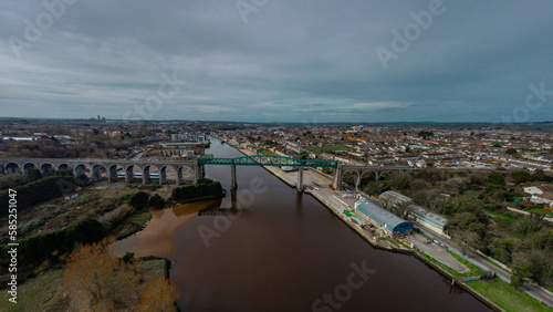 Wallpaper Mural Aerial drone view of Boyne viaduct in drogheda spanning over river Boyne in early evening hours. Beautiful pucture of a green metal viaduct and stone arches. Torontodigital.ca