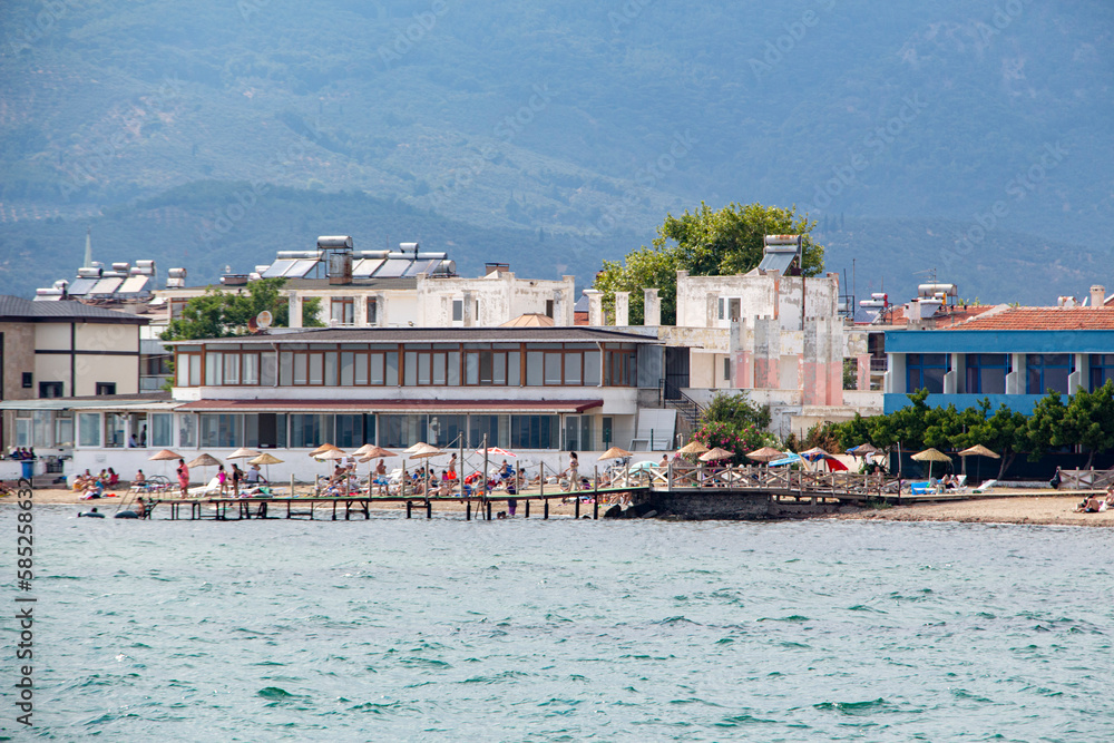 View from the Aegean sea to the shore of Turkey. Houses on the coast of the Aegean Sea
