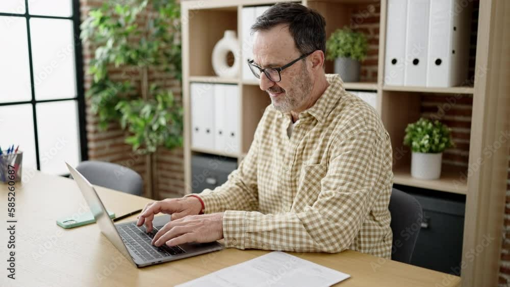 Middle age man business worker using laptop working at office Middle age man business worker using laptop working at office