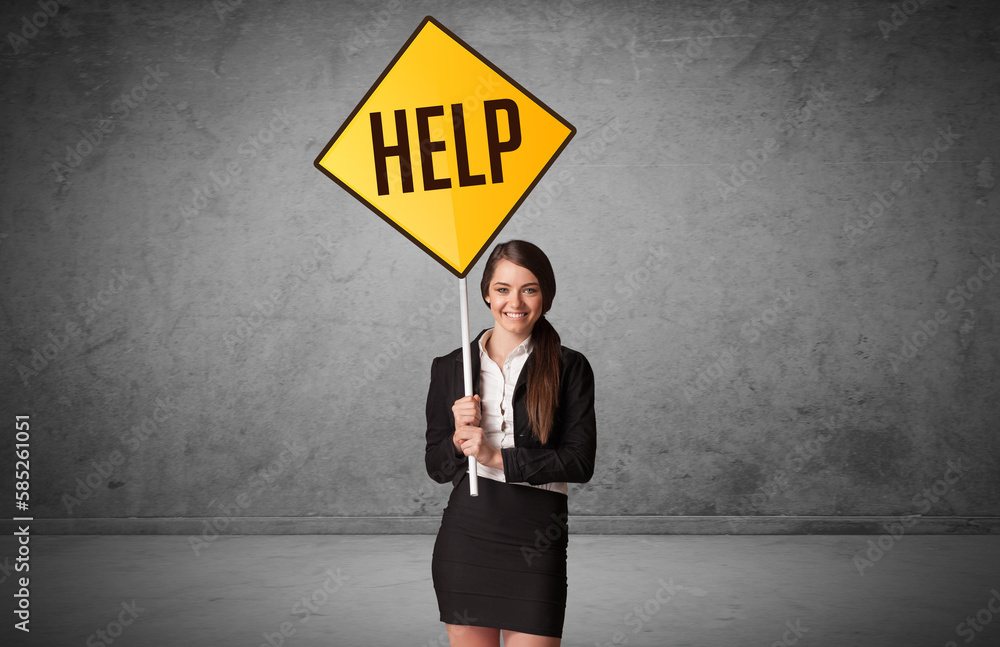 Young business person holding road sign Young business person holding road sign