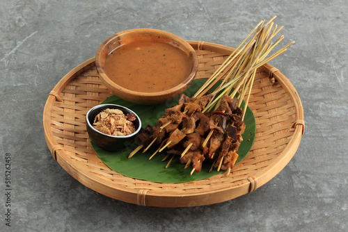 Fototapeta Naklejka Na Ścianę i Meble -  Sate Padang. Spicy Beef Satay from Padang, West Sumatra.