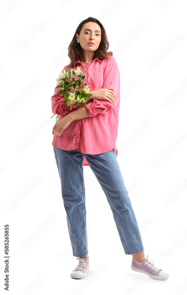 Young woman in pink shirt with alstroemeria flowers on white background Young woman in pink shirt with alstroemeria flowers on white background