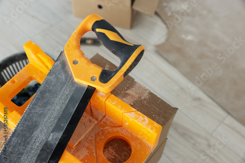 Wallpaper Mural Saw and miter box for decorative brick installation indoors, closeup Torontodigital.ca