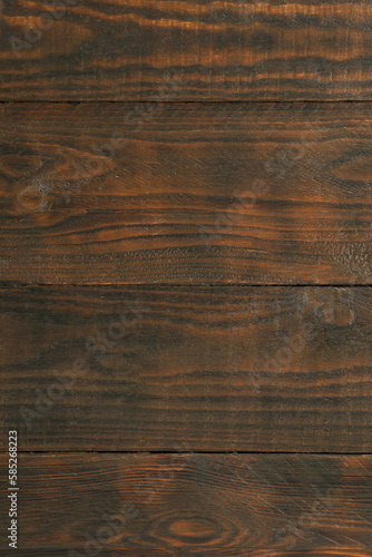 Texture of dark wooden surface as background, closeup