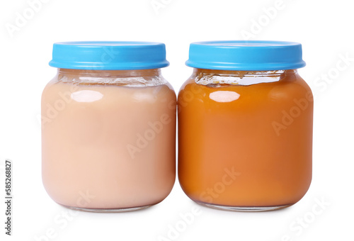 Glass jars with healthy baby food isolated on white
