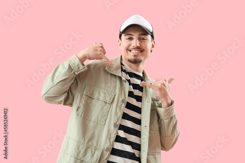 Cool young man showing "cal...