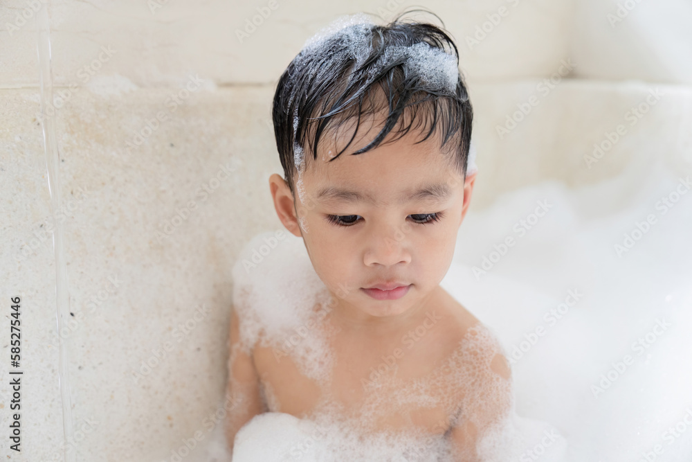 boy taking a bath in the tub take bath he plays with bubbles boy taking a bath in the tub take bath he plays with bubbles