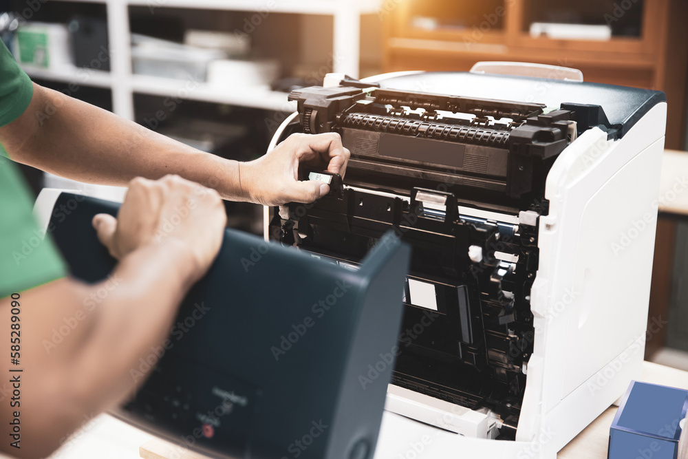 Technician hand open cover photocopier or photocopy to fix repair