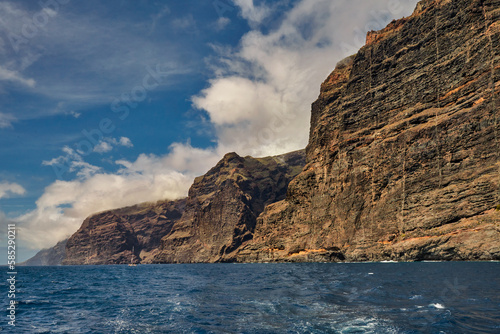 View from the deck of the yacht to the cliffs called Los Gigantes, Tenerife, Canary Islands, Spain