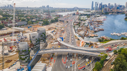 Aerial drone view of Rozelle Interchange showing major construction works and the large chimney towers with Anzac Bridge and Sydney City in the background in March 2023   photo