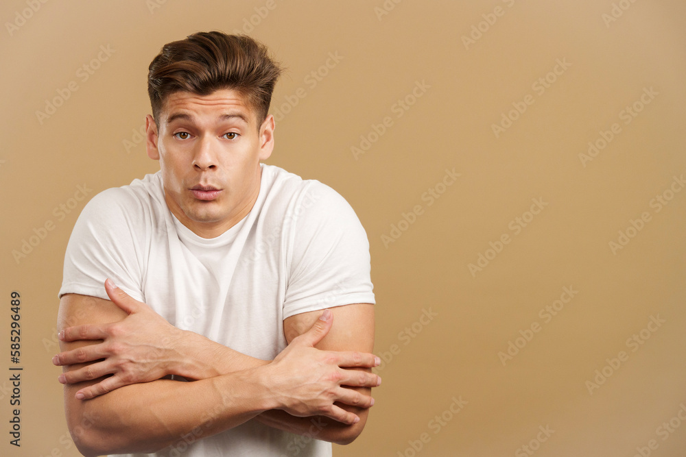 Man looking at camera woman gesturing he is cold Man looking at camera woman gesturing he is cold