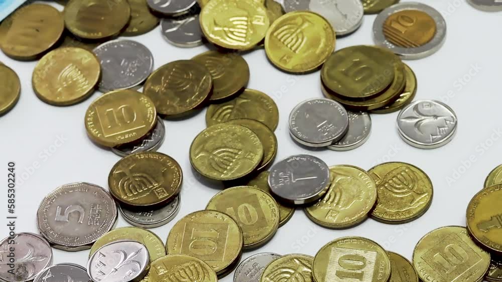 Israeli coins of the Bank of Israel. Israeli money is called Shekel, Sheqel, Shekels or Sheqalim. The slow motion video shows coins - 10, 5, 2 and 1 shekel, as well as smallest coins 50 and 10 agorot Israeli coins of the Bank of Israel. Israeli money is called Shekel, Sheqel, Shekels or Sheqalim. The slow motion video shows coins - 10, 5, 2 and 1 shekel, as well as smallest coins 50 and 10 agorot