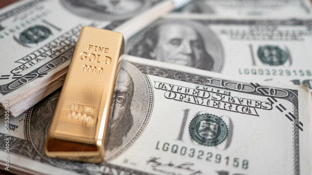 gold bars place on the phone that opens the candlestick chart. and dollar. Fluctuations in gold prices concept. gold bars place on the phone that opens the candlestick chart. and dollar. Fluctuations in gold prices concept.