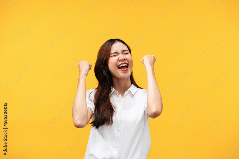 Young asian woman wearing white short sleeve shirt and raising a Young asian woman wearing white short sleeve shirt and raising a