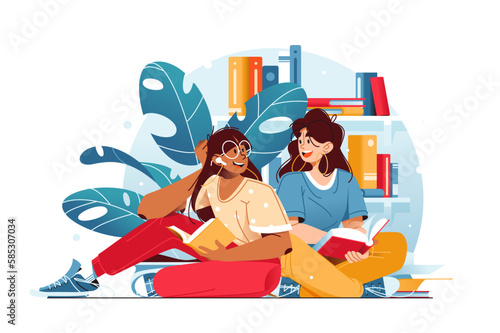 Girls sitting on floor reading books