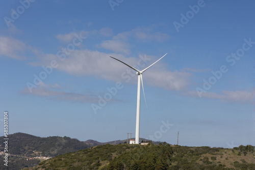 White windmill on the background of a blue sky