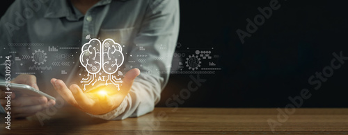 Man showing brain AI (artificial intelligence) technology Machine learning concept, Science and innovation futuristic,Assistance work in futuristic business world innovative of industrial revolution.