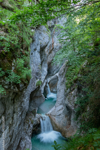 Waterfalls cascading in between narrow rock faces inside the Garnitzenklamm in the Austrian state of Carinthia