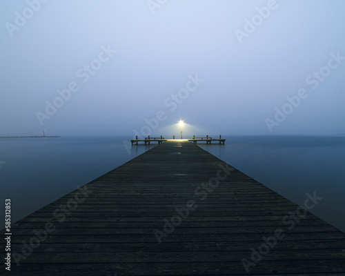 Mystical Morning: Foggy Dock at Sunset Liminal Space Background
